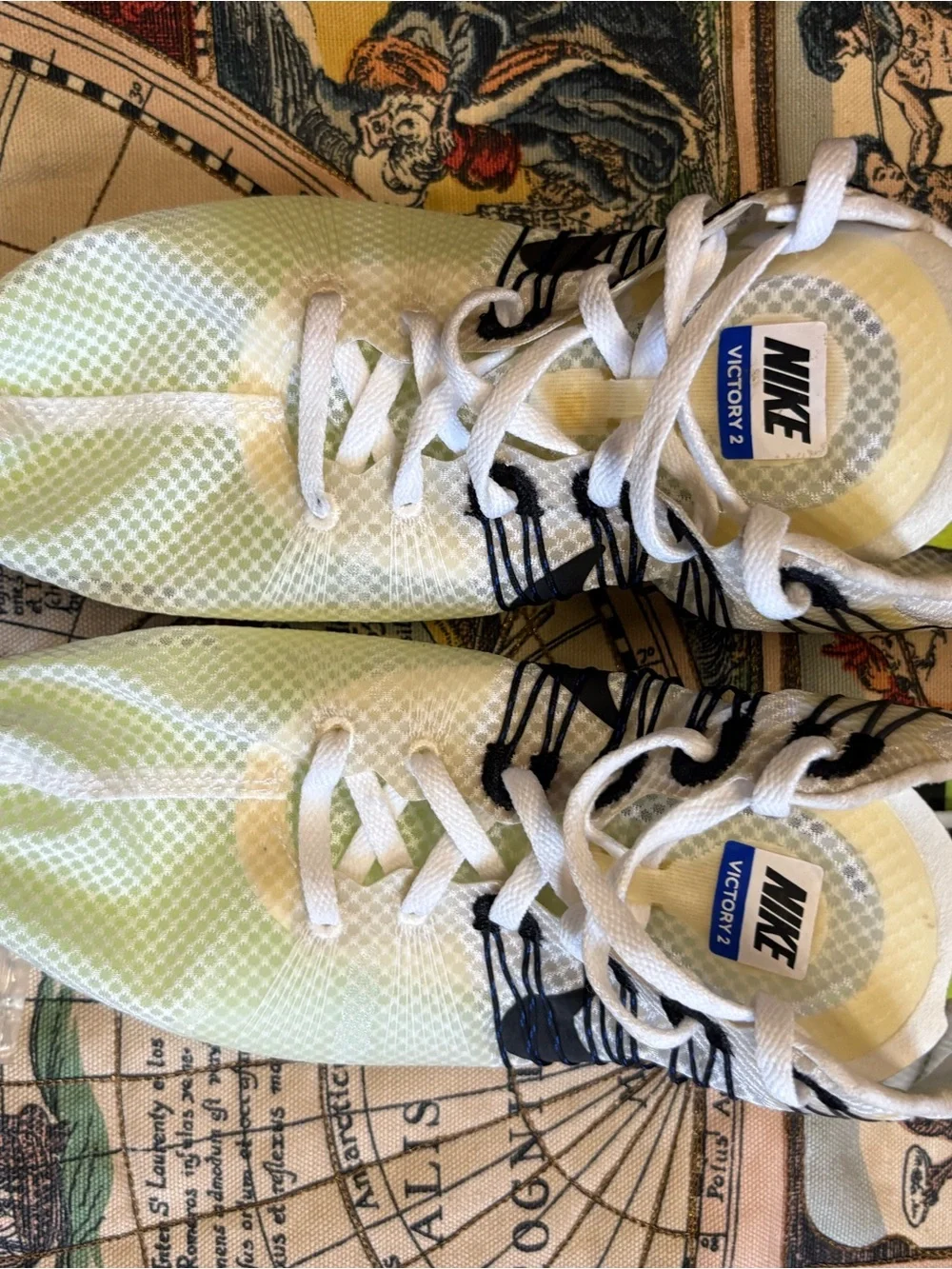 Nike White Sneakers with Neon Green Accents and Blue Outsole